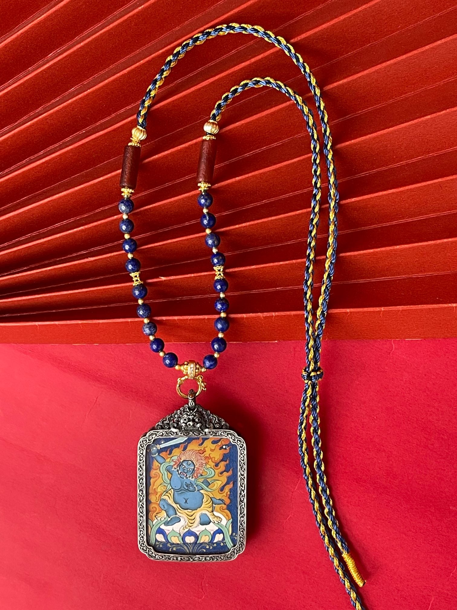 Hand-painted Tibet Acala (不动明王) Thangka pendant 3.5x4.5cm with refined silver casing featuring steadfast will, representing courage and rational wisdom in Buddhist tradition.
