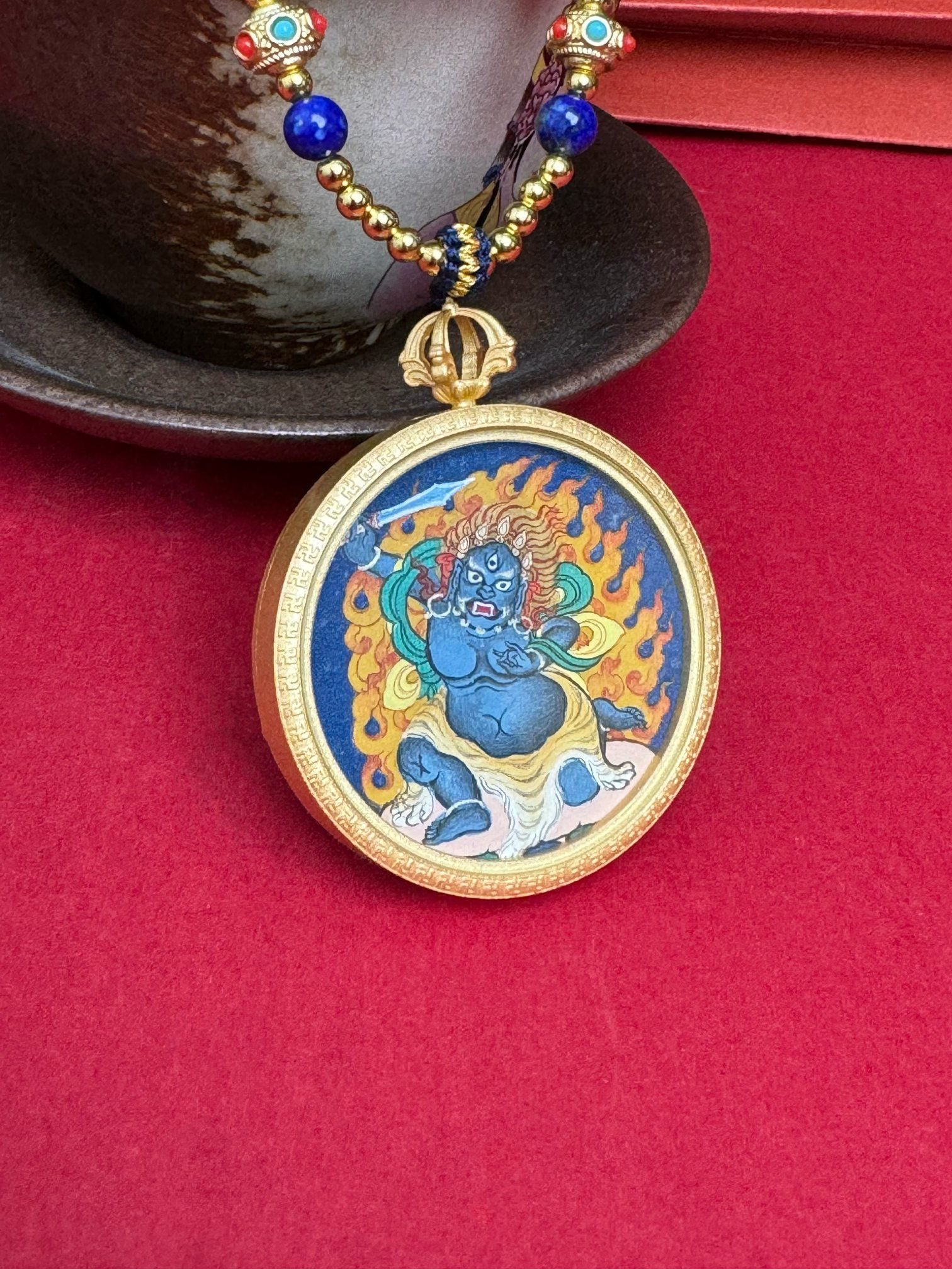 Detailed view of the refined copper casing for the Acala Thangka pendant, symbolising protection and tradition in Buddhist practice.
