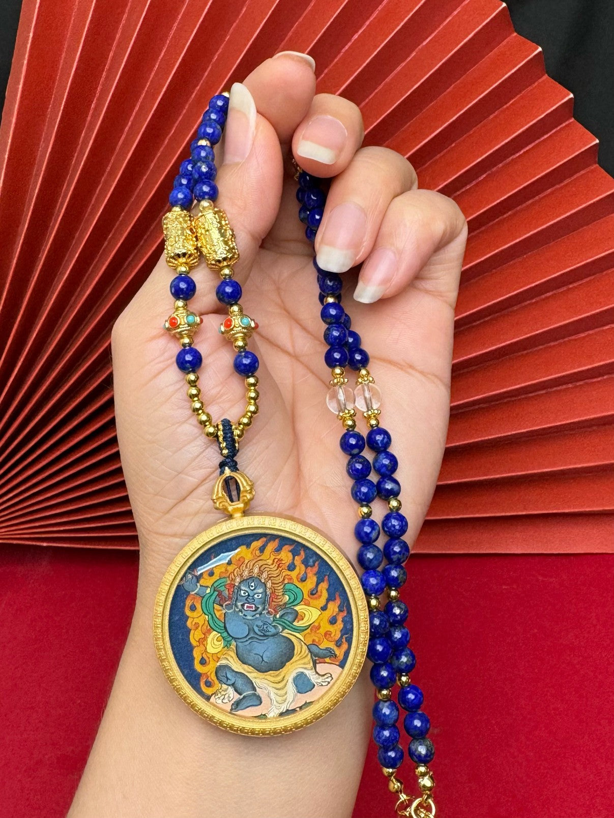  The Tibet Bold Acala Thangka pendant with copper casing displayed as a sacred amulet for protection and the removal of obstacles, embodying Buddhist tradition.

