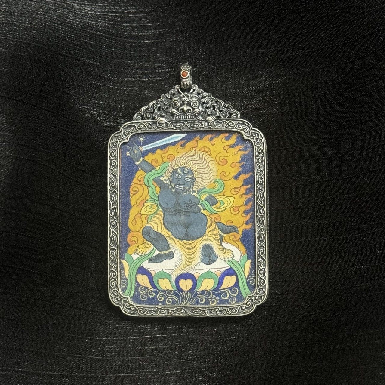 Hand-painted Tibet Coarse Acala Thangka pendant featuring the chief of the Five Wisdom Kings, encased in vintage silver, representing protection and wisdom in Tibetan Buddhist tradition.

