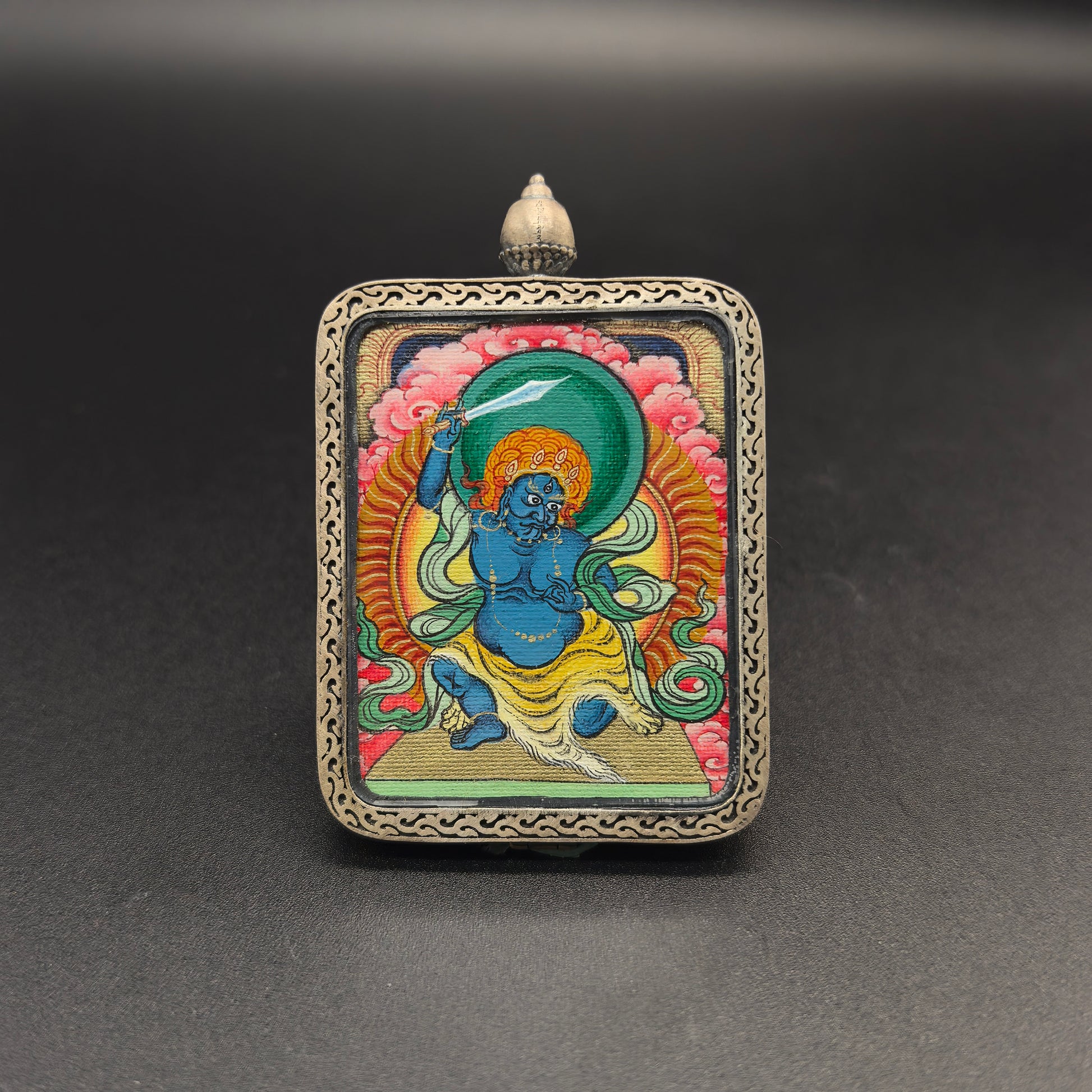  Close-up detail of the Tibet Red Cloud Acala Thangka painting showing natural mineral pigments, showcasing the masterful artistry of the hand-painted tradition.
