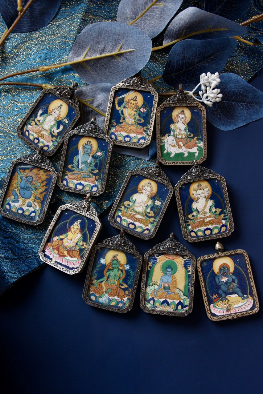 Fudo Myo-o thangka pendant representing a wrathful protector deity, associated with courage and the removal of obstacles.