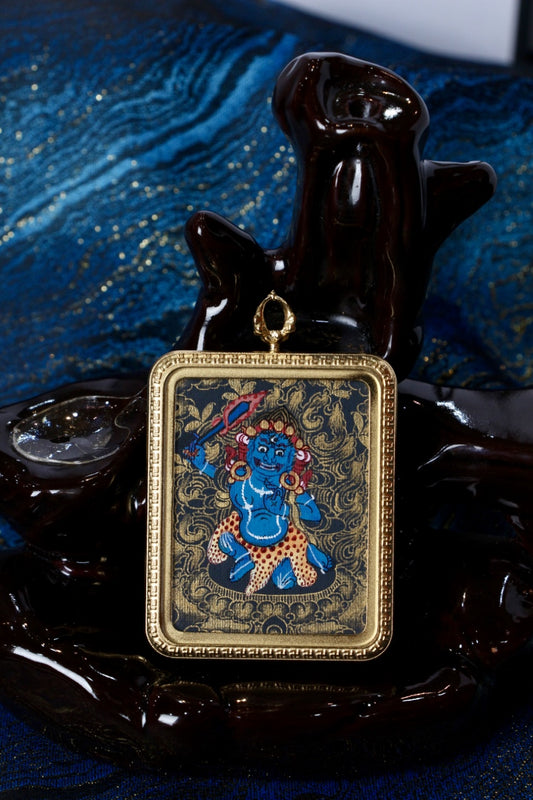 Acala thangka pendant used in Tibetan Buddhism as a protector symbol, offering courage, stability, and spiritual protection.
