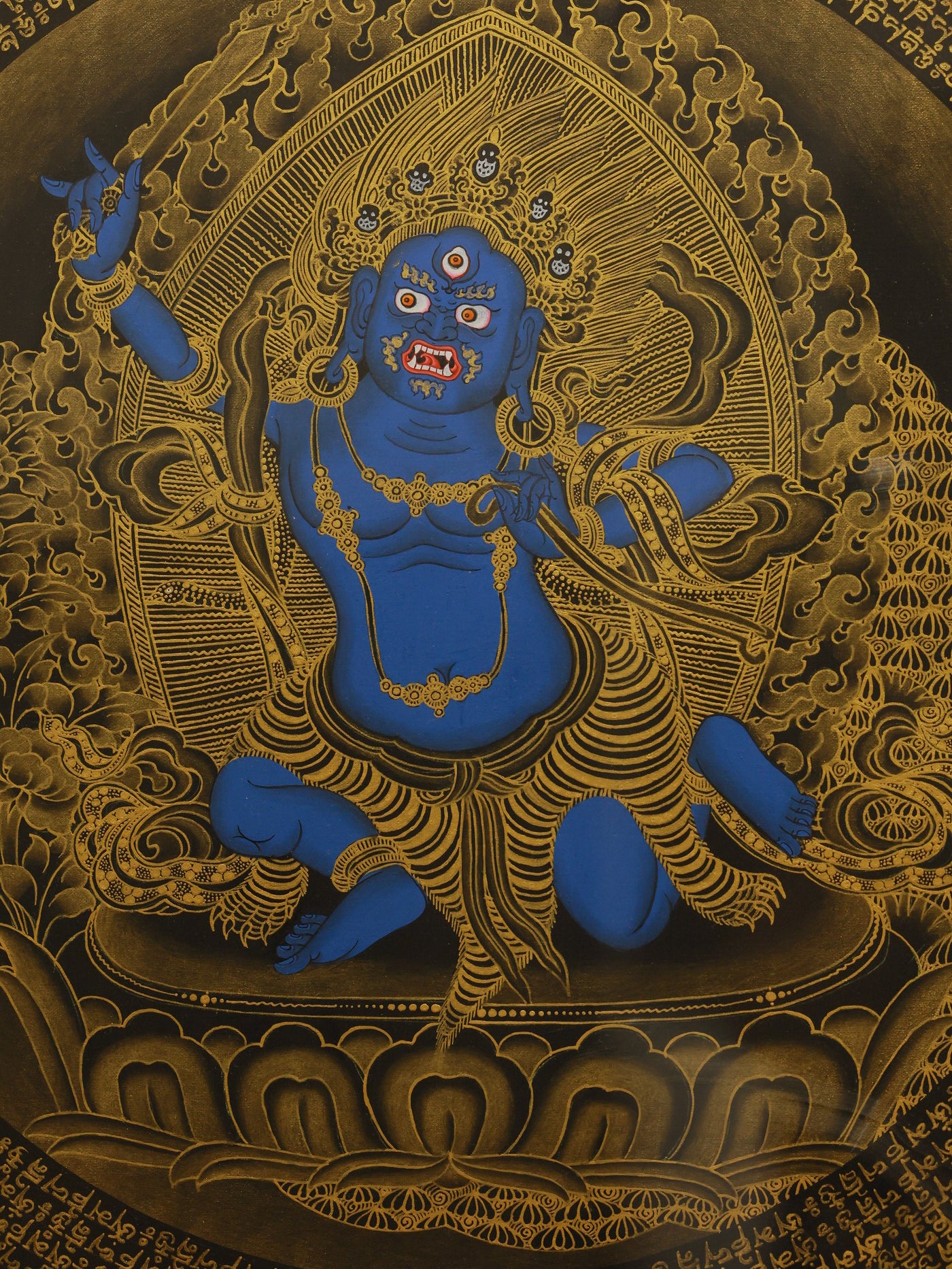 Tibetan Buddhist protection thangka featuring Achala Vidyaraja and the six-syllable mantra used in Vajrayana practice.