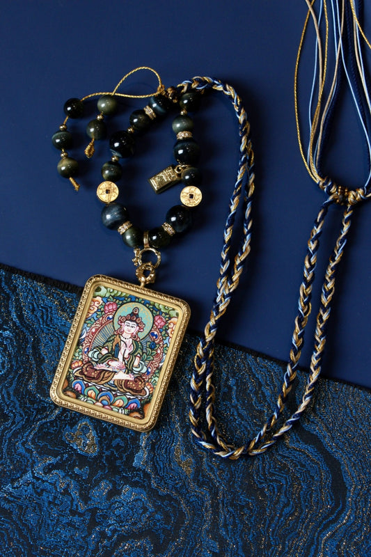 Akasagarbha Bodhisattva thangka pendant depicting the Tibetan Buddhist deity of boundless wisdom and merit.