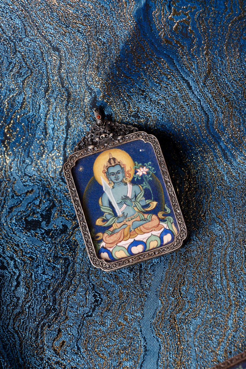 Akasagarbha Bodhisattva thangka pendant depicting the Tibetan Buddhist deity of boundless wisdom and spiritual insight.