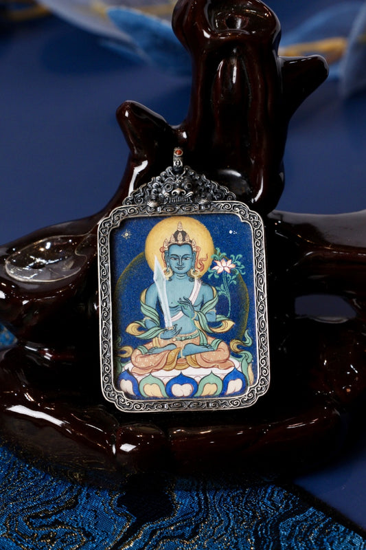Akasagarbha thangka pendant representing the Bodhisattva of infinite knowledge, wisdom, and spiritual guidance in Tibetan Buddhism.