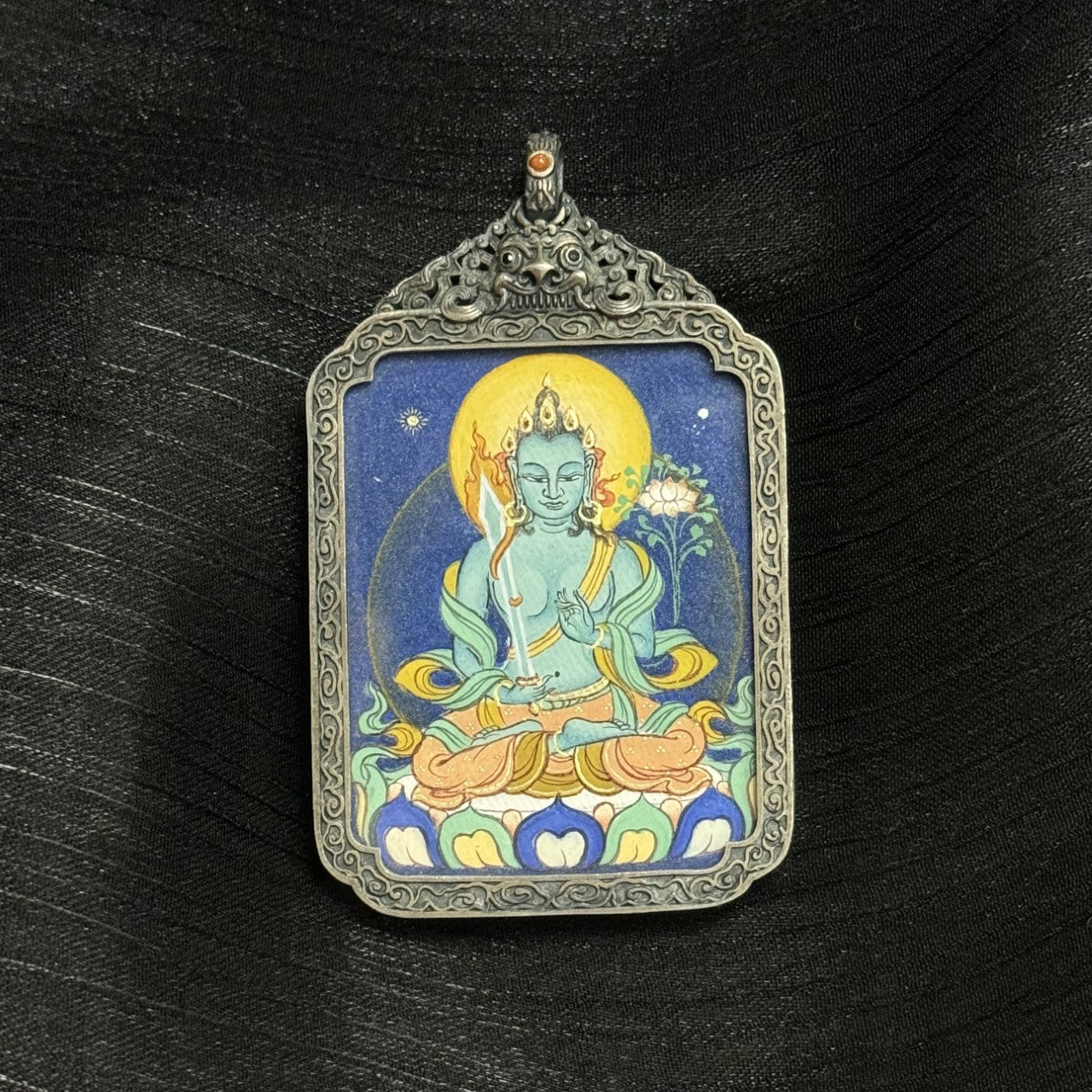  Close-up detail of the Bold Akasagarbha Thangka painting showing intricate natural mineral pigment work and symbolic attributes, showcasing the artistry of Tibetan lineage painters.
