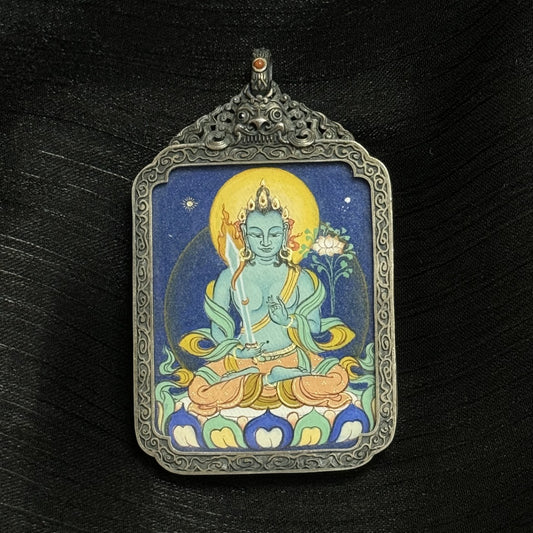 The Bold Akasagarbha Thangka pendant displayed as a sacred amulet for wealth and noble support, embodying the treasury of merit in Tibetan Buddhist tradition.
