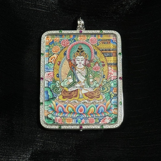  The Akasagarbha with Eight Guardians and Mandala Thangka pendant displayed as a sacred amulet for wealth and protection, embodying Tibetan Buddhist tradition.

