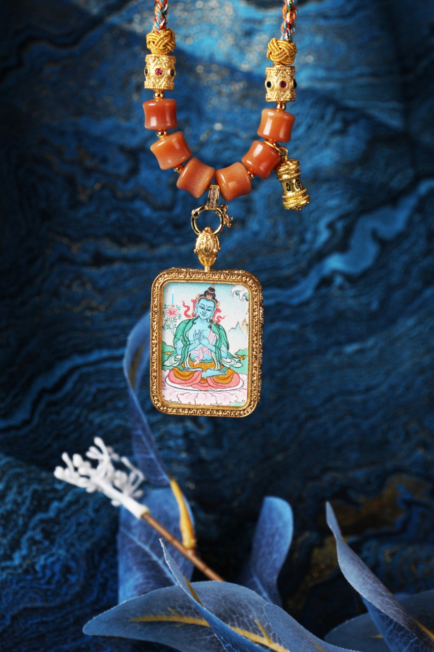 The Karma Kagyu Akasagarbha Thangka pendant displayed as a sacred amulet for wealth and prosperity, embodying the space treasury wisdom of Tibetan Buddhist tradition.
