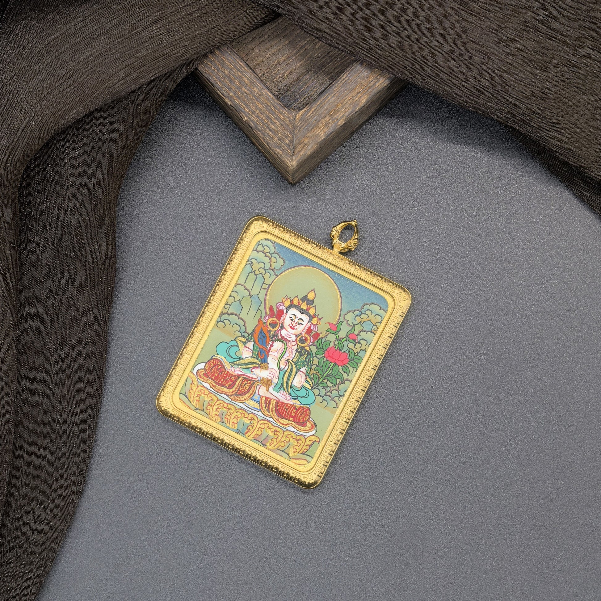  The Nepal Akasagarbha Thangka pendant with titanium casing displayed as a sacred amulet for wisdom and wealth, embodying Buddhist tradition.
