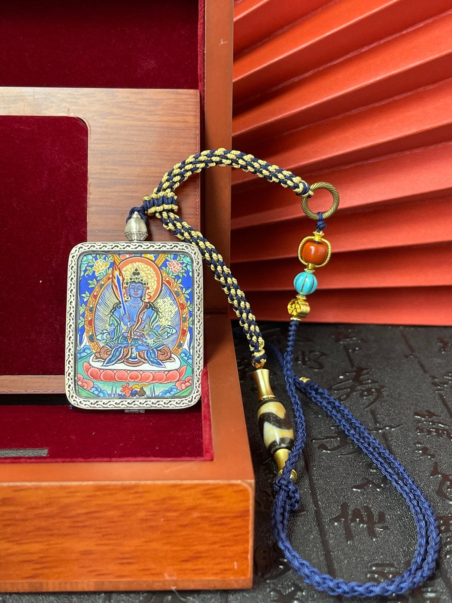  Hand-painted Rekong Akasagarbha (虚空藏菩萨) Thangka pendant 3.4x4.5cm with silver casing featuring wisdom as weapon and wealth as vast as the void, representing wisdom in Buddhist tradition.
