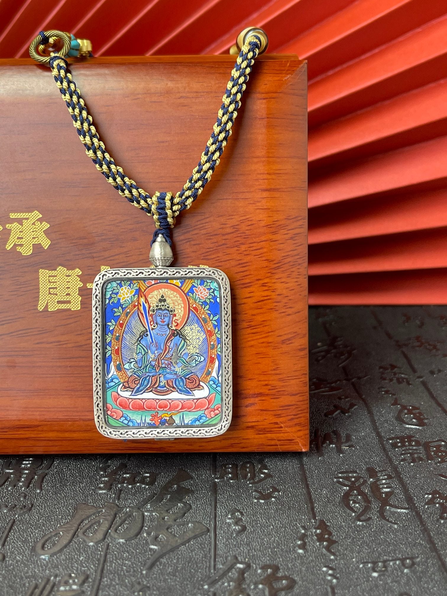  Close-up detail of the Rekong Akasagarbha Thangka showing hand-painted mineral pigments, gold and lapis, showcasing the masterful artistry.
