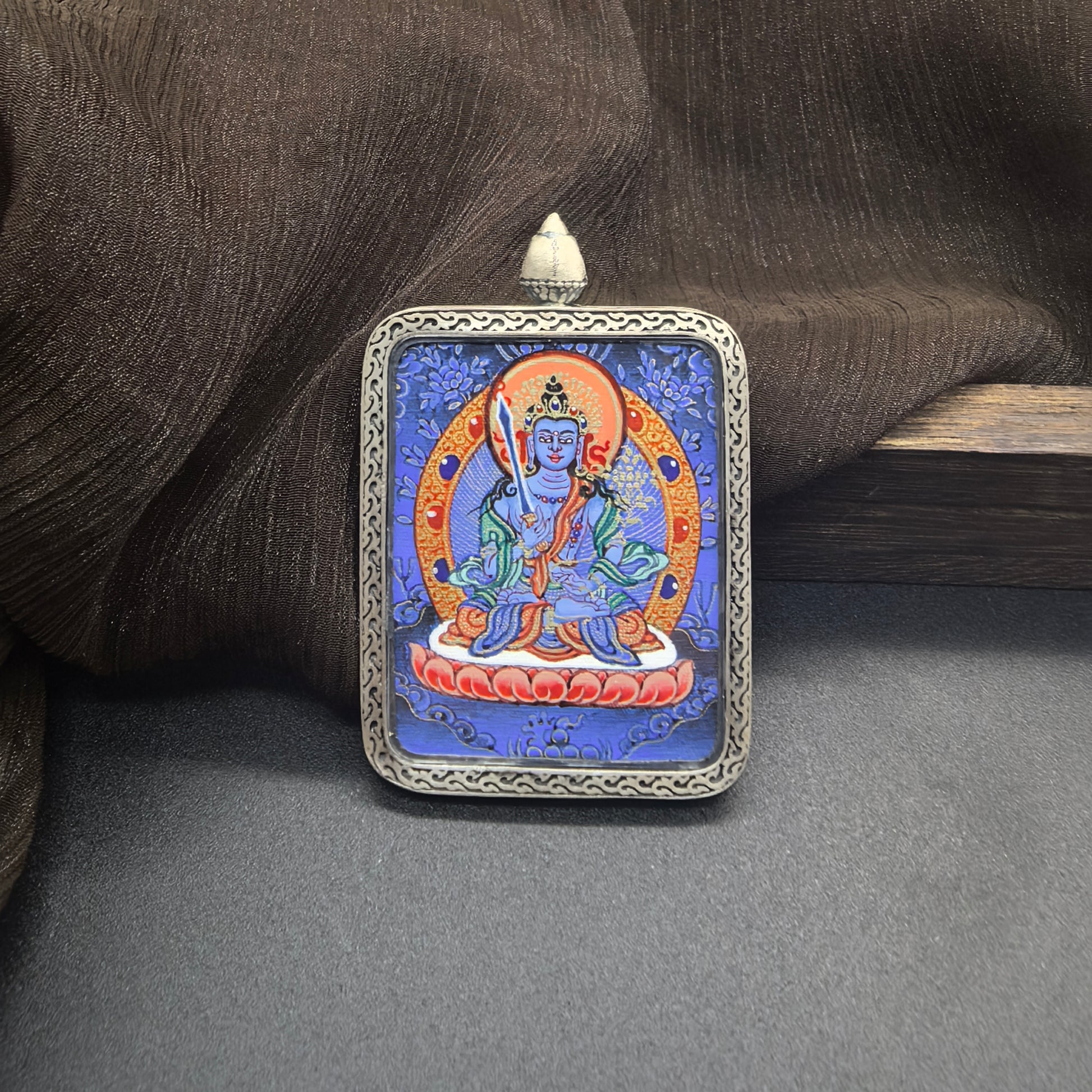  Close-up detail of the Rekong Blue Thangka Akasagarbha painting showing natural mineral pigments, showcasing the masterful artistry of Rekong lama painters.
