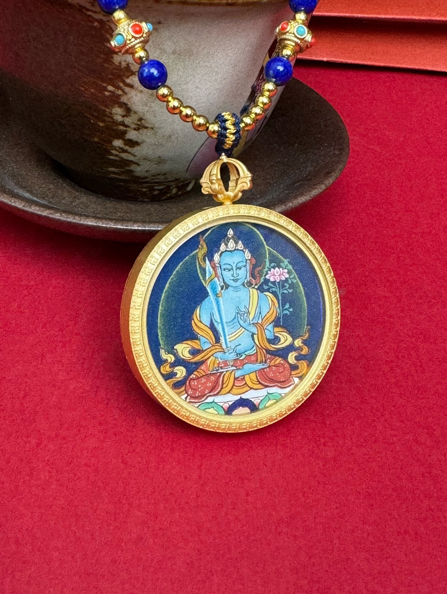  Close-up detail of the Tibet Bold Akasagarbha Thangka showing hand-painted mineral pigments, gold and lapis, showcasing the masterful artistry and three-dimensional imagery.

