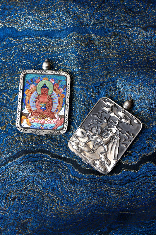 Close-up of the S925 sterling silver case with Dunhuang Nine-Colored Deer engraving, protecting the Amitabha Buddha Thangka.