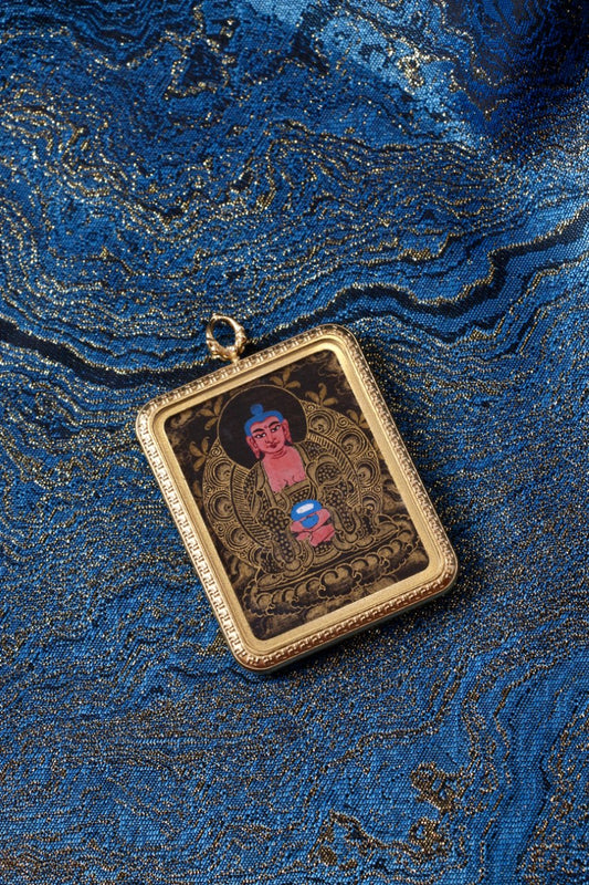 Amitabha Buddha thangka pendant depicting the Buddha of Infinite Light and compassion in Tibetan Buddhist culture.