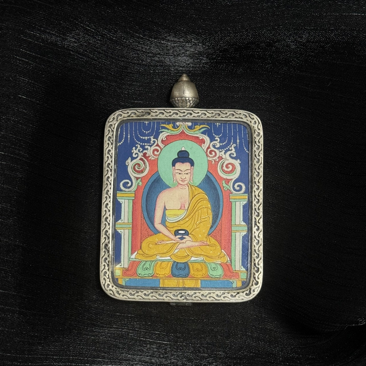  Close-up detail of the Chigung Amitabha Thangka painting showing intricate natural mineral pigment work and serene iconography, showcasing the artistry of Tibetan lineage painters.
