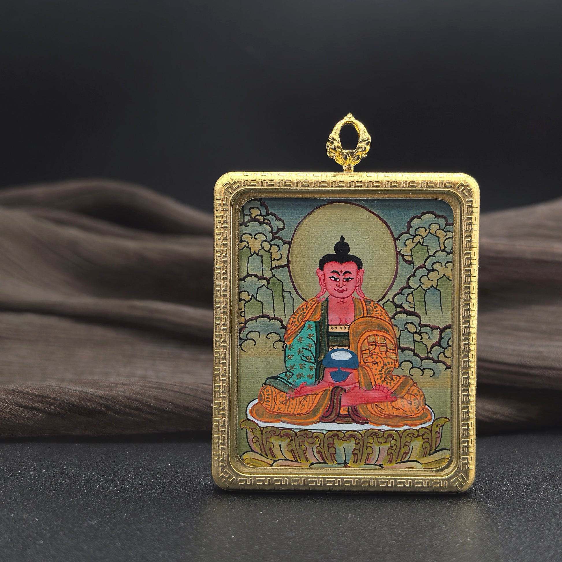 Detailed view of the titanium casing for the Amitabha Thangka pendant, symbolising peace and tradition in Buddhist practice.
