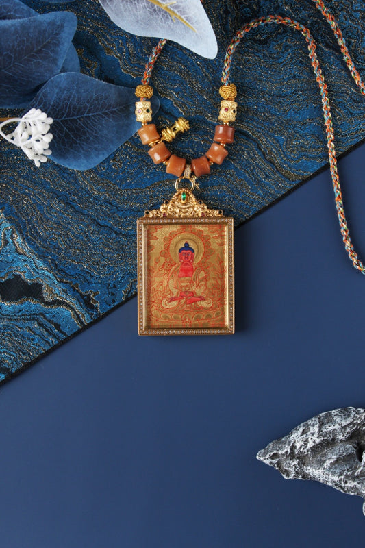 Detailed view of the titanium steel casing for the Amitabha Buddha Thangka pendant, symbolizing protection and elegance in Tibetan Buddhist tradition.

