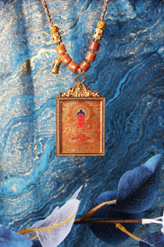 The Rebgong Amitabha Buddha Thangka pendant displayed as a sacred amulet for longevity, wisdom, and Pure Land rebirth, embodying the infinite light and compassionate protection of Tibetan Buddhist tradition.
