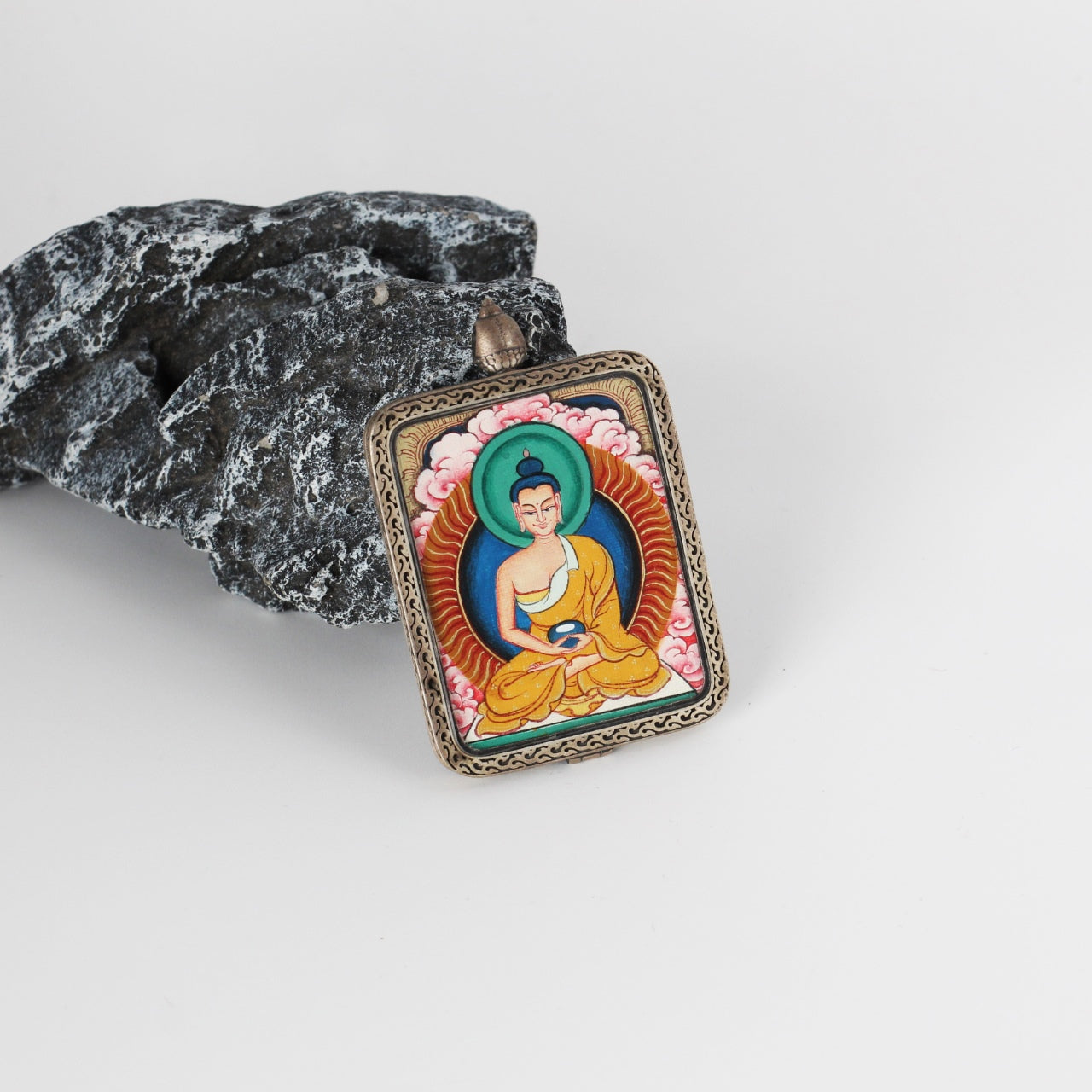  The Rebgong Amitabha Thangka pendant displayed as a sacred amulet for liberation and peace, embodying Tibetan Buddhist tradition.

