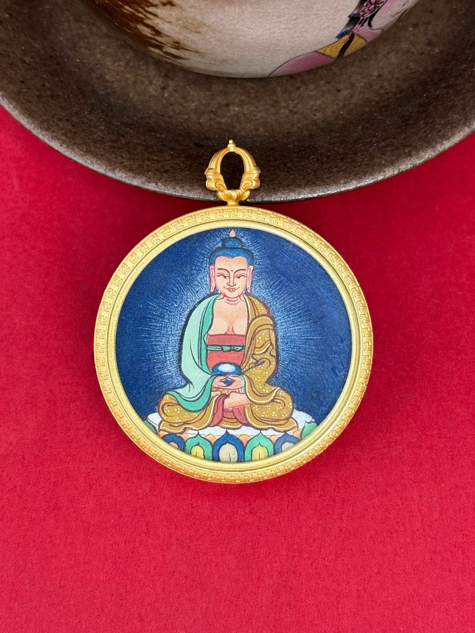 Close-up detail of the Tibet Bold Amitabha Thangka showing hand-painted mineral pigments, gold and lapis, showcasing the masterful artistry and three-dimensional imagery.
