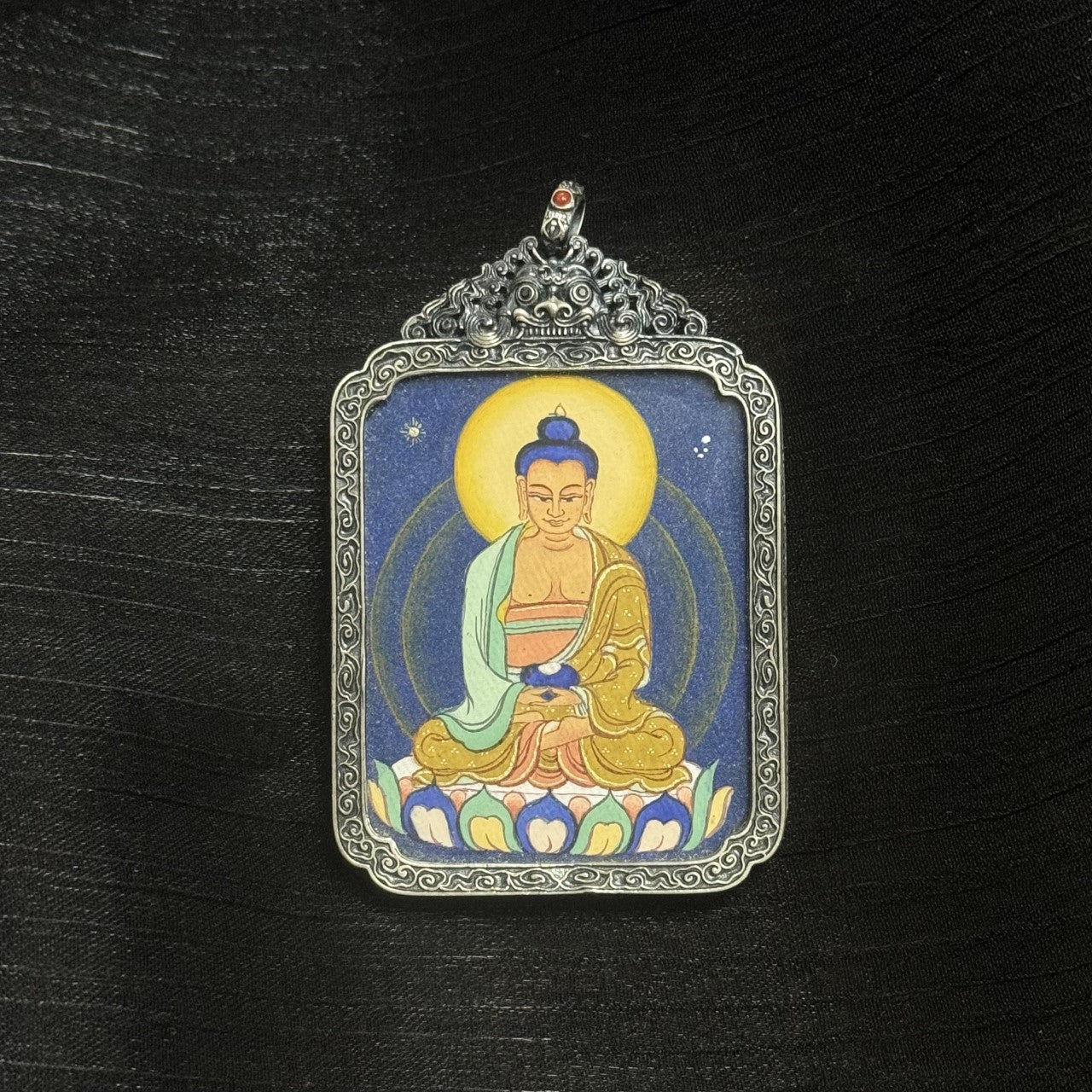Hand-painted Tibet Coarse Amitabha Buddha Thangka pendant featuring the lord of the Western Pure Land, encased in vintage silver, representing peace and purity in Tibetan Buddhist tradition.
