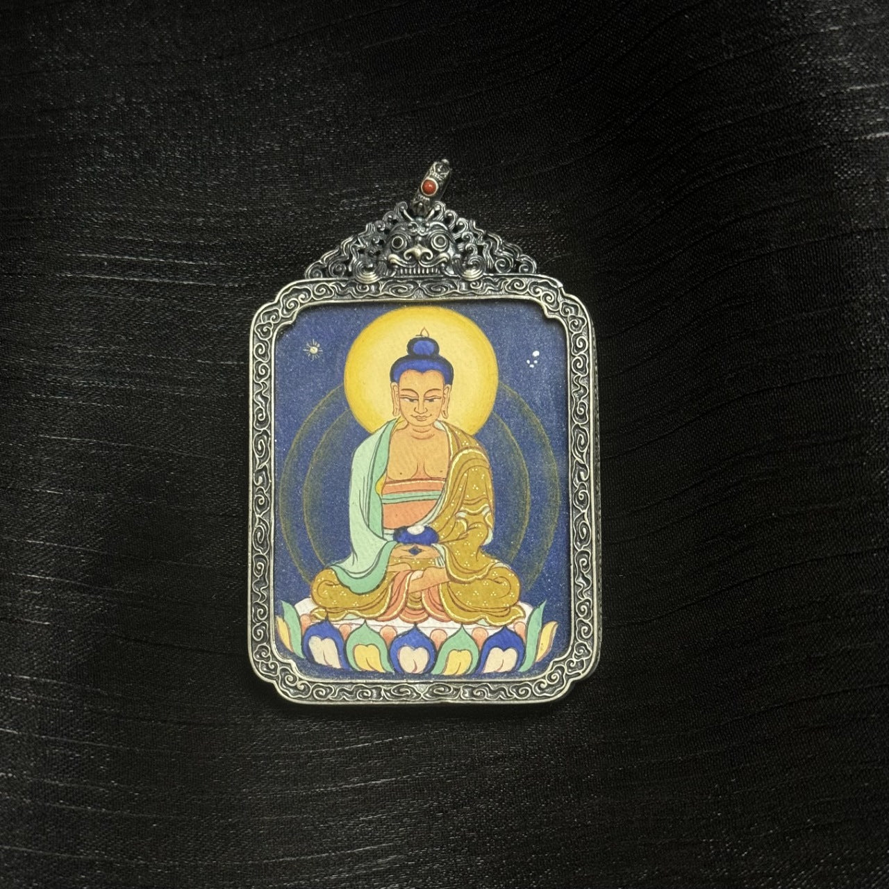  Close-up detail of the Amitabha Tibet Coarse Thangka painting showing intricate natural mineral pigment work, showcasing the artistry of Tibetan lineage painters.

