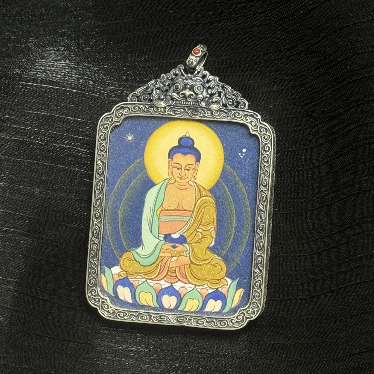  The Tibet Coarse Amitabha Thangka pendant displayed as a sacred amulet for peace and purity, embodying Tibetan Buddhist tradition