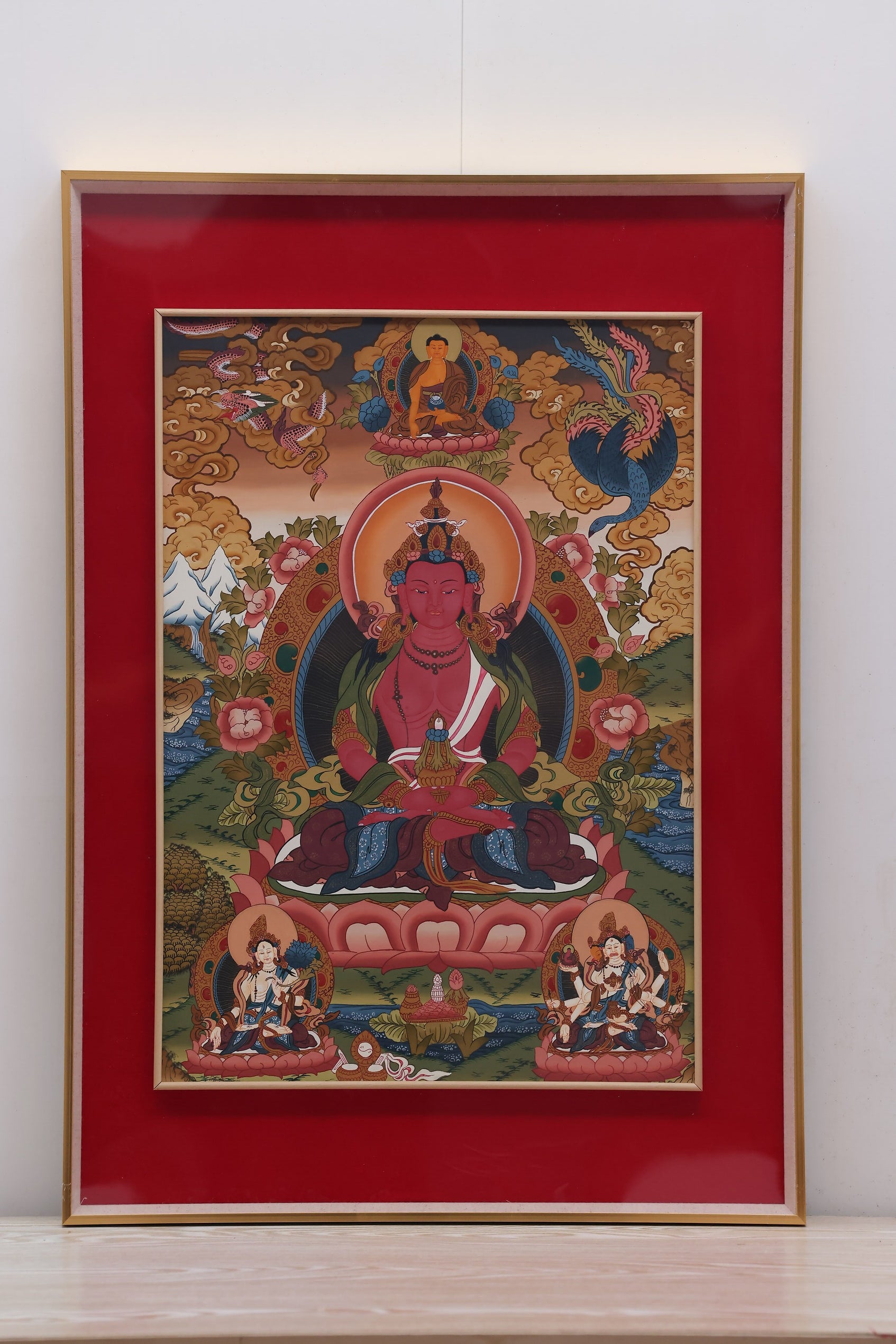 Traditional Tibetan Thangka featuring Amitayus surrounded by auspicious symbols, representing blessings and longevity.