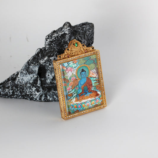 Hand-painted Nepal Premium Bhaisajyaguru Buddha Thangka pendant featuring the Buddha of Healing, encased in titanium steel, representing healing and longevity in Tibetan Buddhist tradition.

