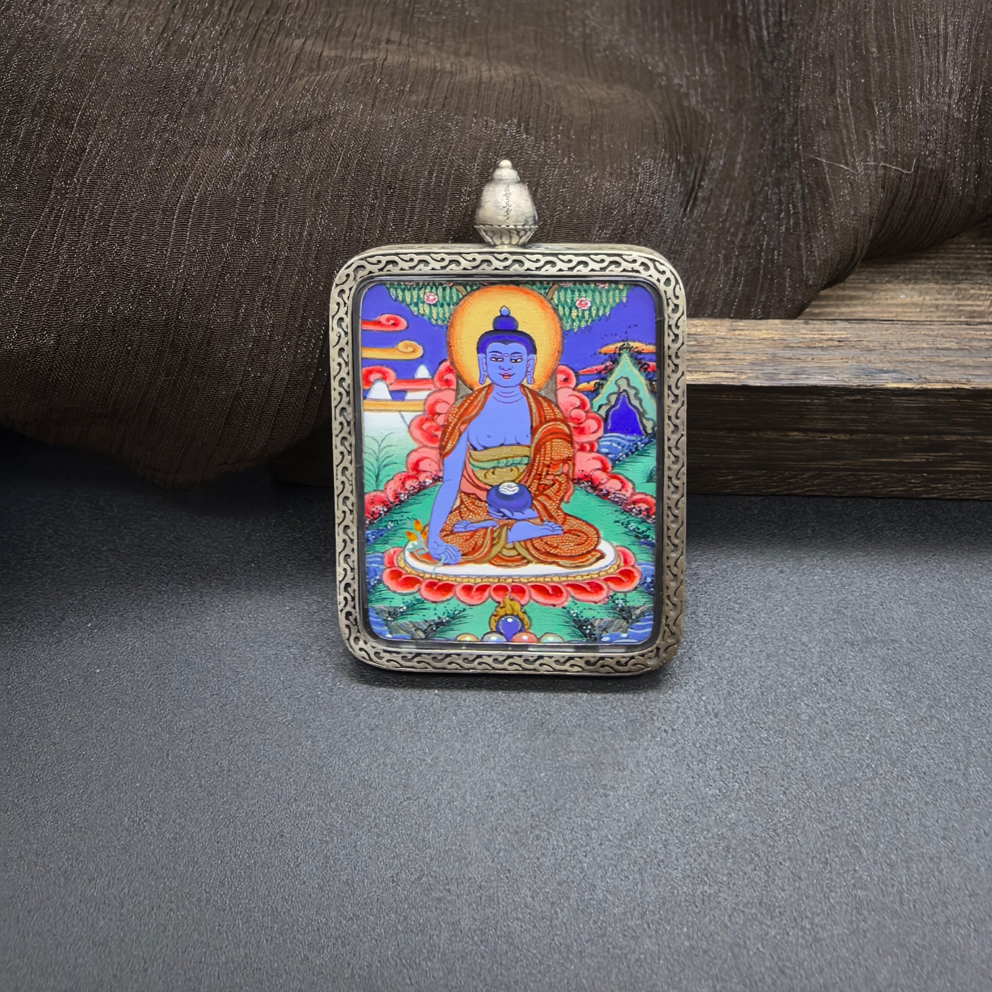 Close-up detail of the Rekong Bhaisajyaguru Thangka painting showing natural mineral pigments, showcasing the masterful artistry of Rekong lama painters.

