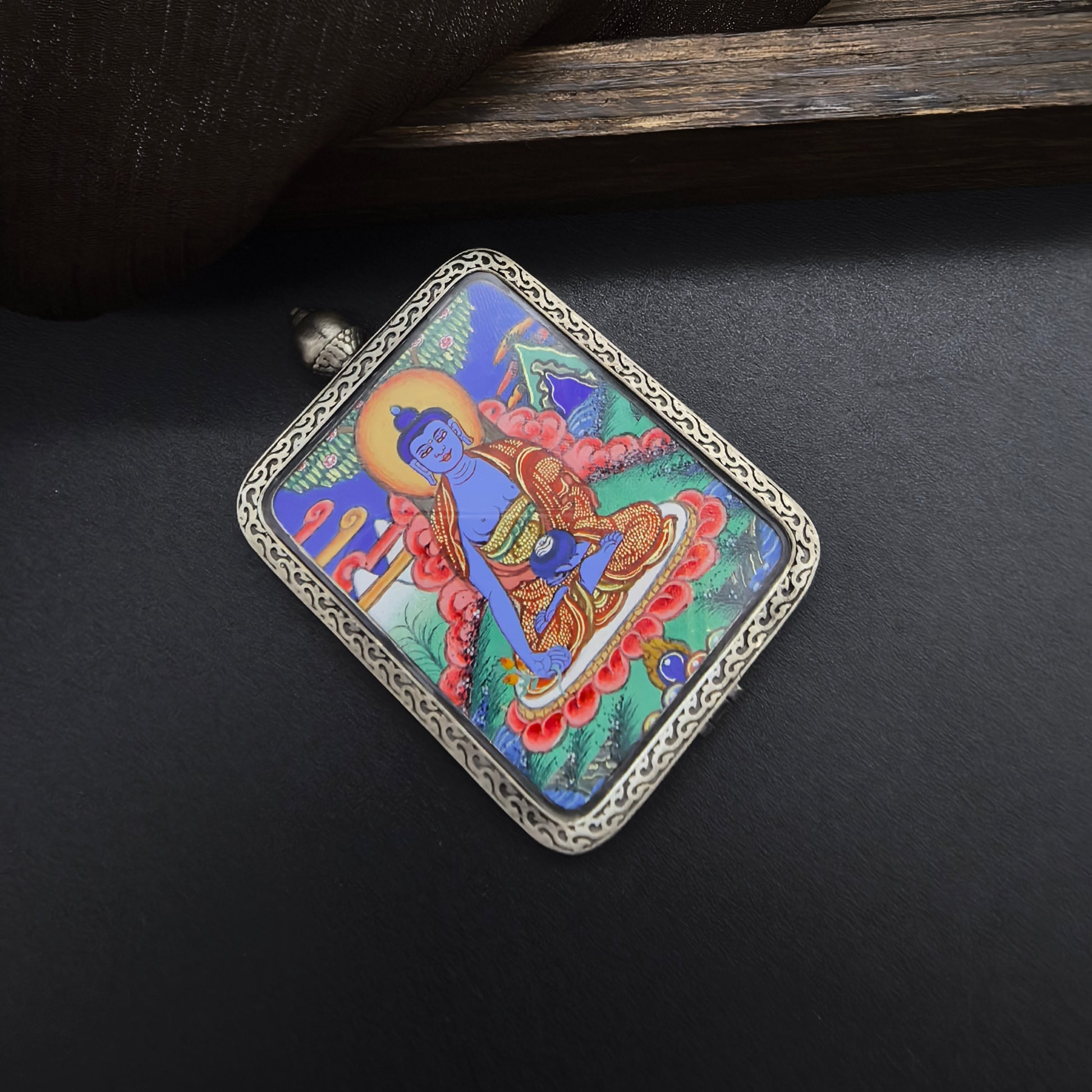 The Rekong Bhaisajyaguru pendant with 925 silver displayed as a sacred amulet for healing and longevity, embodying Buddhist tradition.

