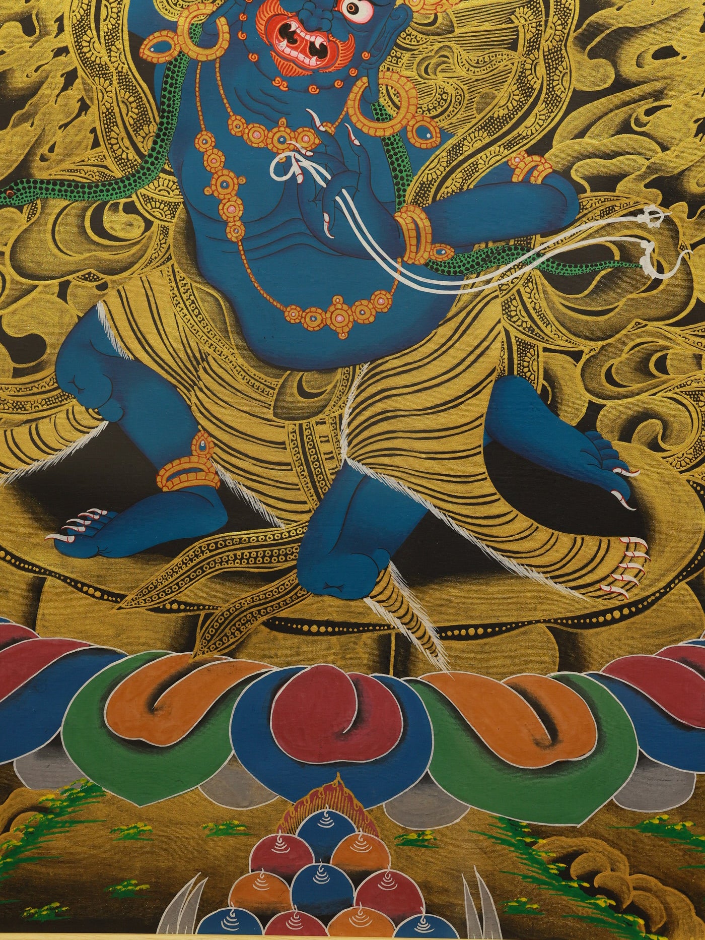 A wrathful Buddha deity, Acala, rendered in a black and gold style Thangka, surrounded by a halo of flames representing wisdom, seated upon a stable rock.