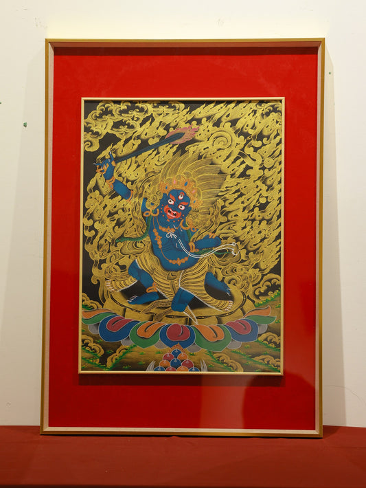 A Thangka painting of Acala Mahakala as a fierce protector in a striking black and gold color scheme, featuring intricate details.