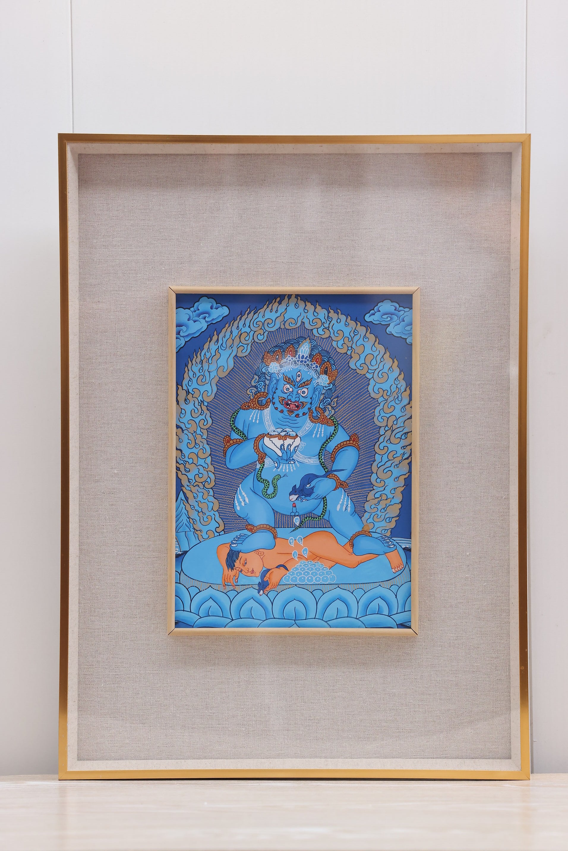 Tibetan Buddhist blue ground thangka of Mahakala, revered as a powerful wealth protector and wrathful guardian.