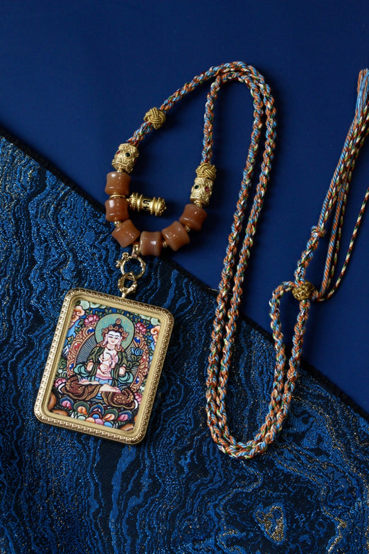 Mahasthamaprapta Bodhisattva Thangka Pendant in Tibetan Buddhist culture, symbolizing wisdom and compassion.