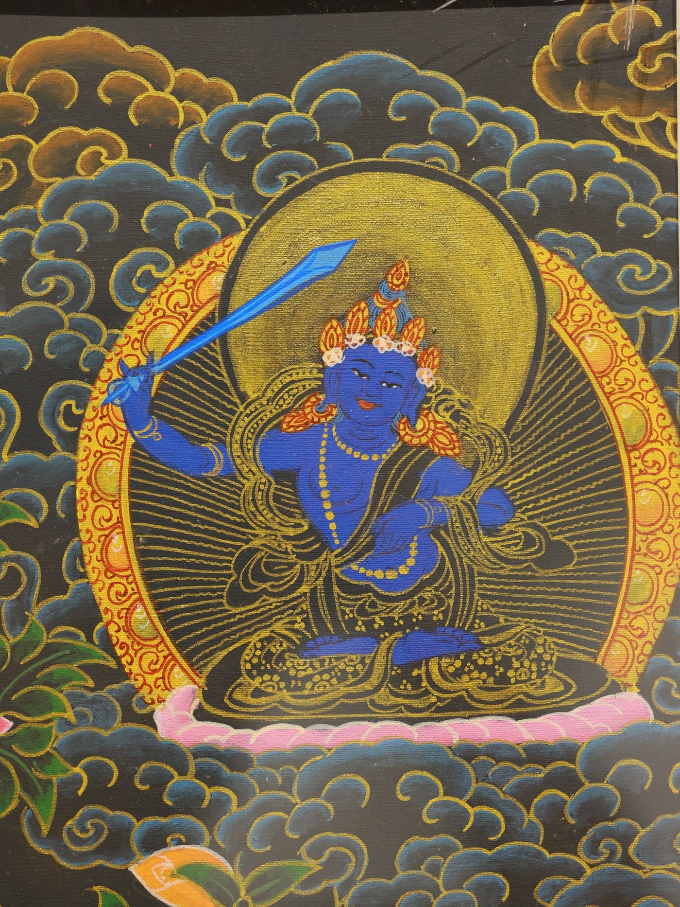 Vajra wisdom Manjushri in black gold Tibetan thangka, embodying clarity, knowledge, and spiritual power