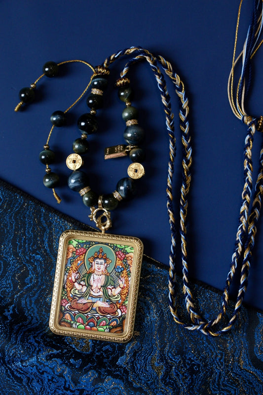 Four-Armed Avalokiteshvara thangka pendant depicting the Tibetan Buddhist deity of compassion and enlightened mercy.