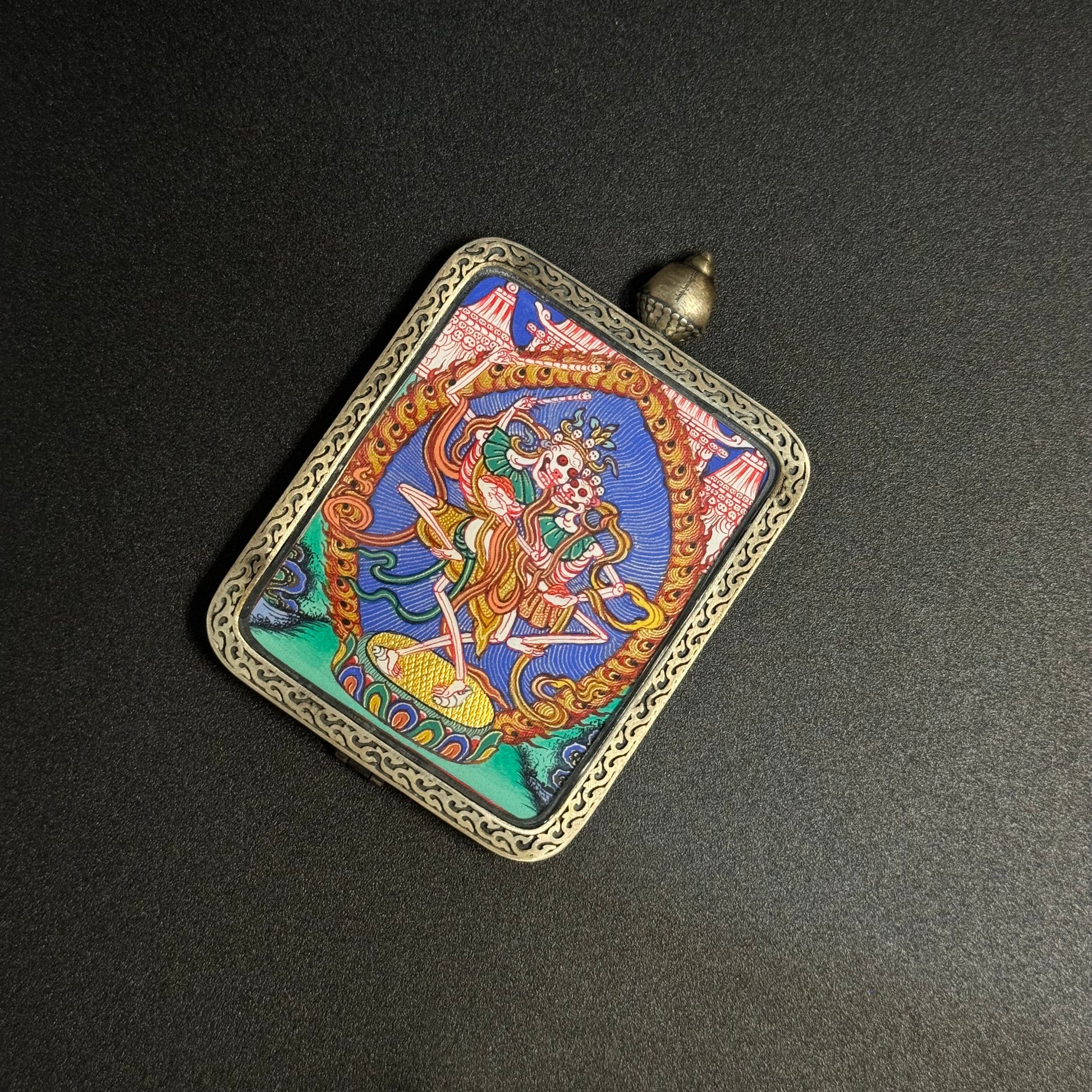 A 3.5x4.5cm hand-painted Rekong Cuiying series Chitipati (Cemetery Lords) Thangka pendant featuring impermanence and protection in Buddhist tradition.
