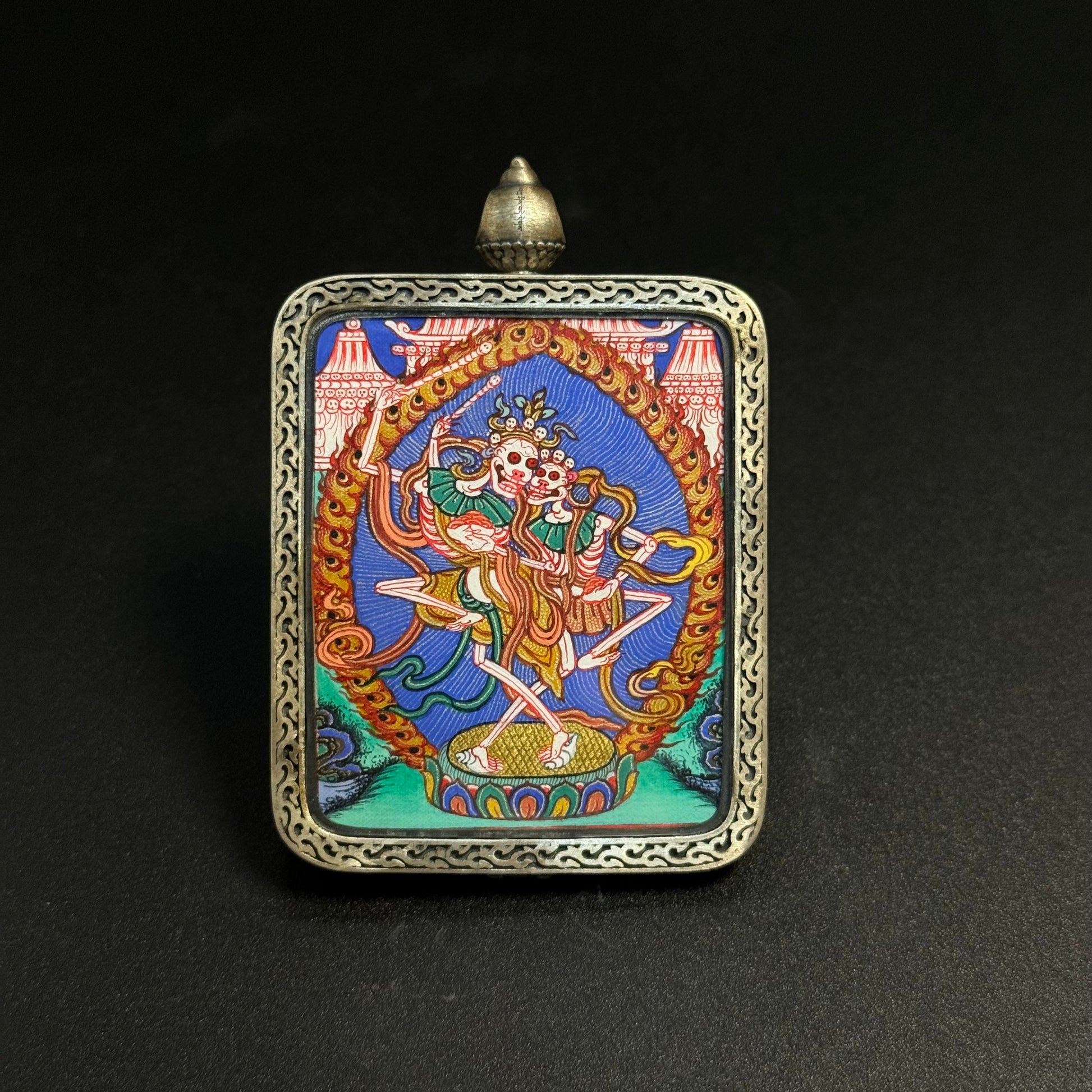  Detailed view of the presentation and casing for the Chitipati Cuiying Thangka pendant.
