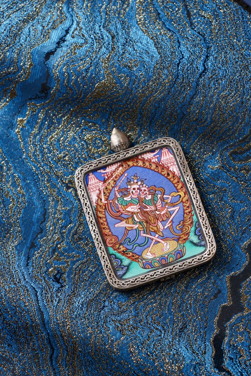 Chitipati Tibetan protector deity thangka amulet pendant, inspired by Vajrayana teachings on impermanence and liberation