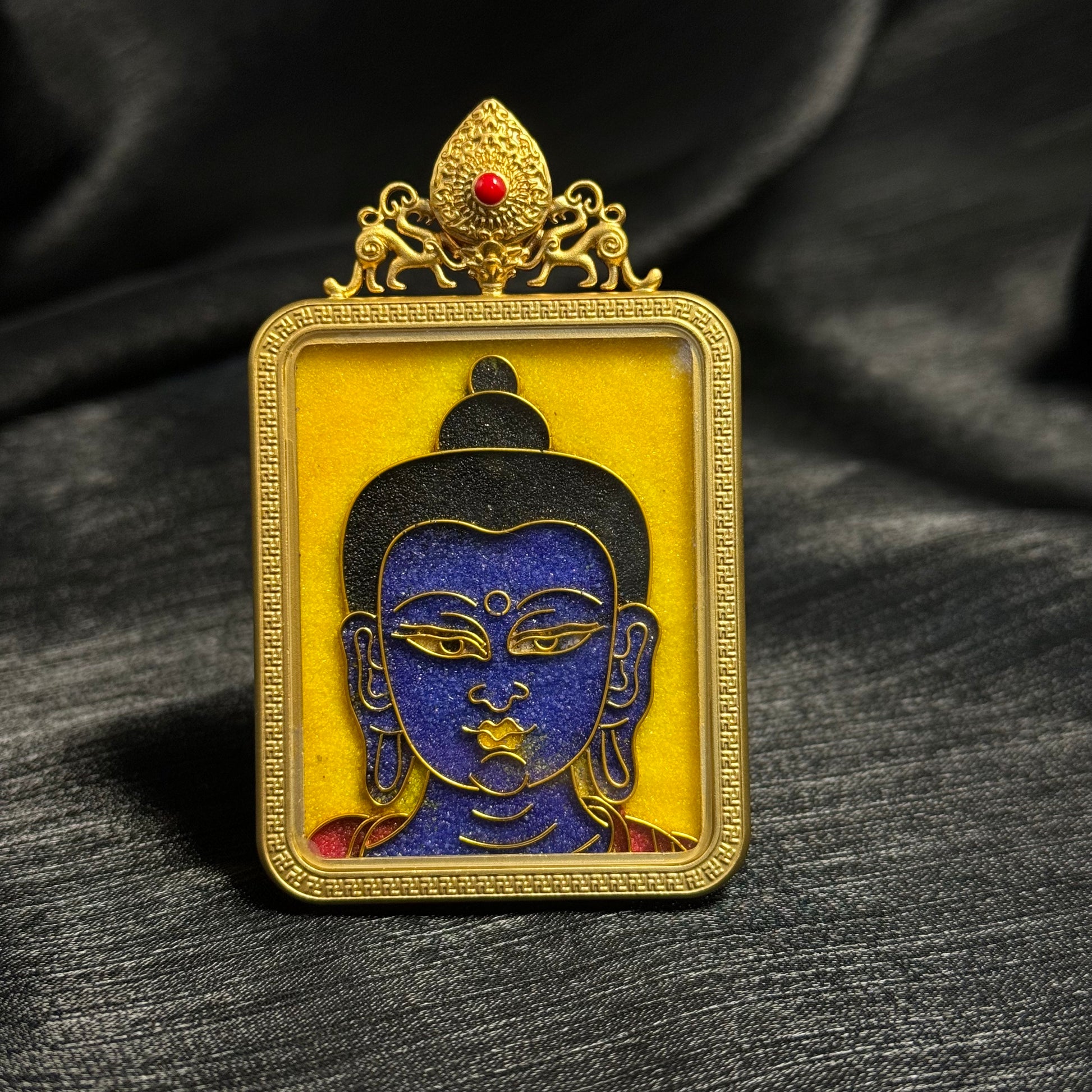  Detailed view of the copper 24K gold-plated casing for the Bhaisajyaguru cloisonné Thangka pendant.
