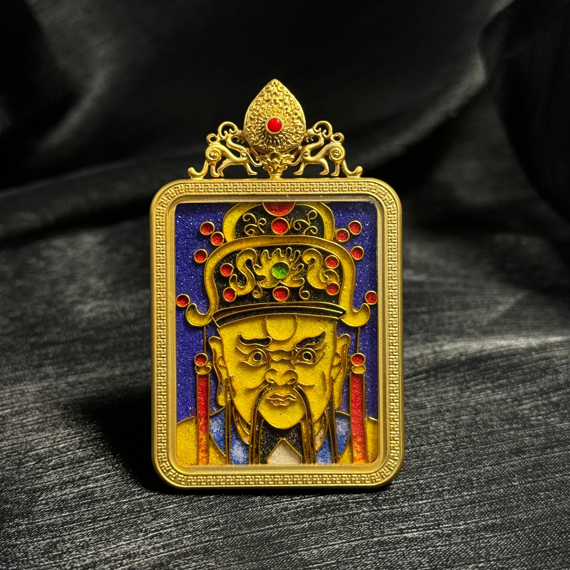 Detailed view of the copper 24K gold-plated casing for the Dragon King cloisonné Thangka pendant.
