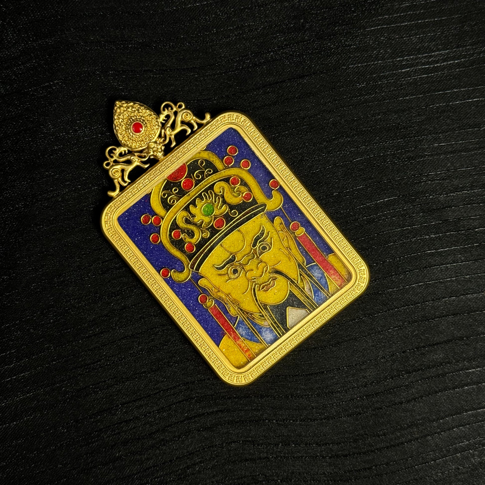 The cloisonné Dragon King Thangka pendant displayed as a sacred amulet for wealth and blessing.
