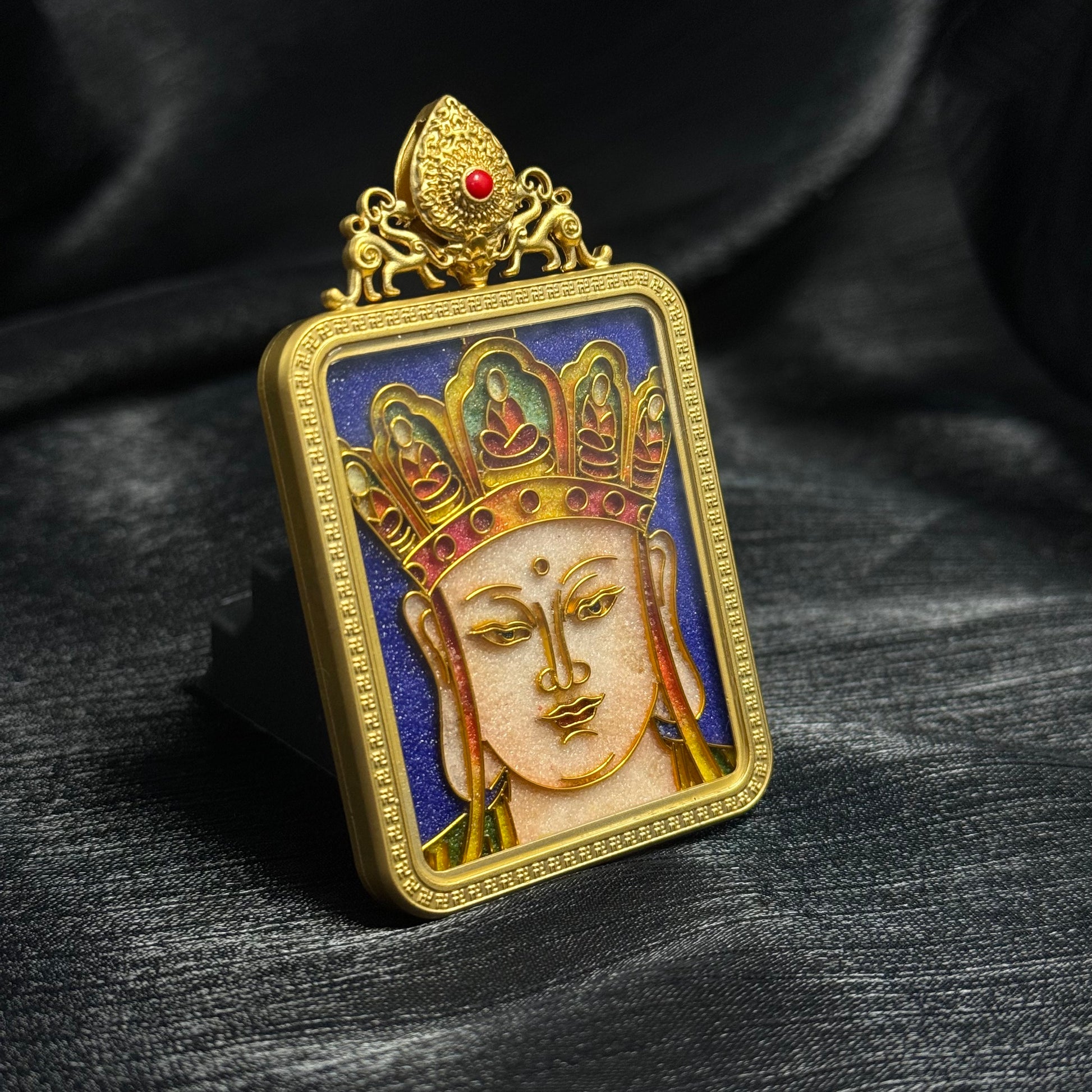 A 4x5cm cloisonné Ksitigarbha (Earth Store Bodhisattva) Thangka pendant with copper 24K gold-plated casing, representing compassion and protection in Buddhist tradition.

