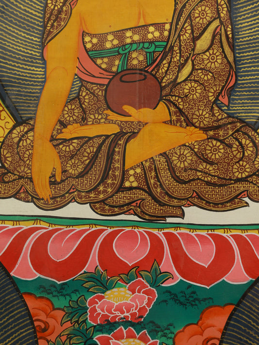 Shakyamuni Buddha seated in meditation posture, traditional Tibetan color thangka representing inner peace and spiritual awakening.