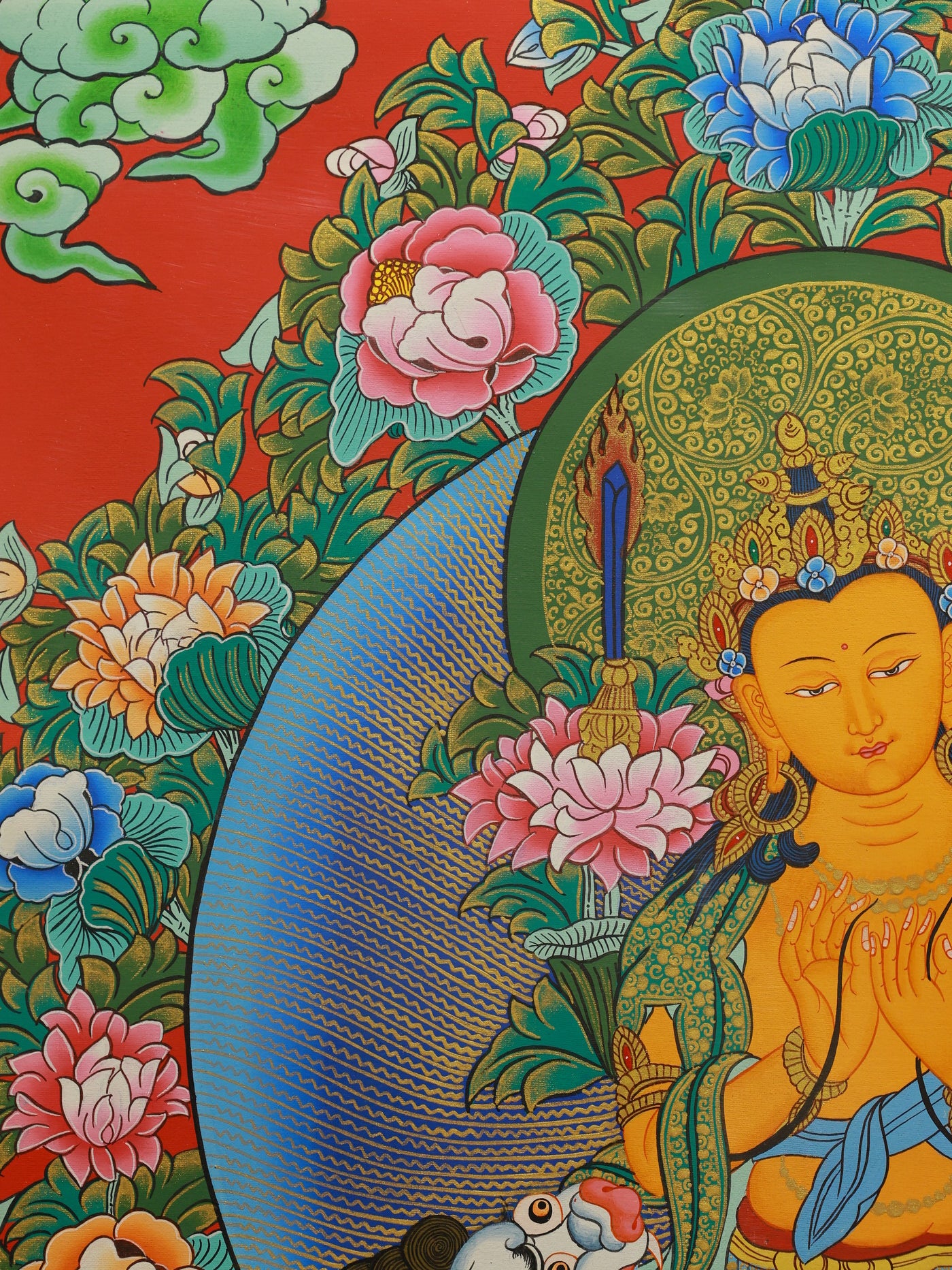 Colorful Tibetan Buddhist Thangka depicting Manjushri Bodhisattva with lotus and scripture.